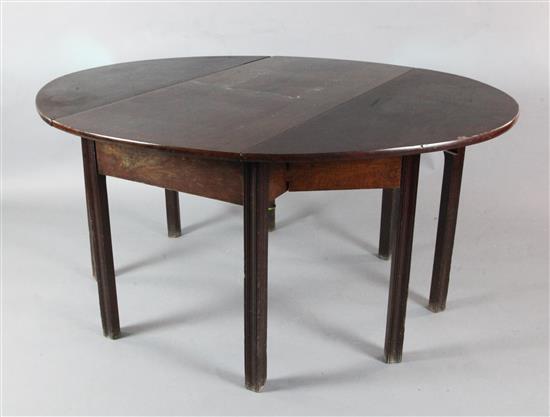 A George III mahogany double gateleg table opens to 2ft 4in. x 4ft 11in.